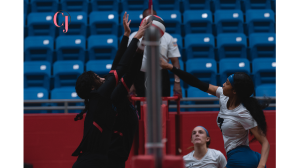 McKenna Linton, number 14 on Duncanville team and her teammates blocked the ball. Duncanville wins 3-1 against Everman Bulldogs Tuesday night.