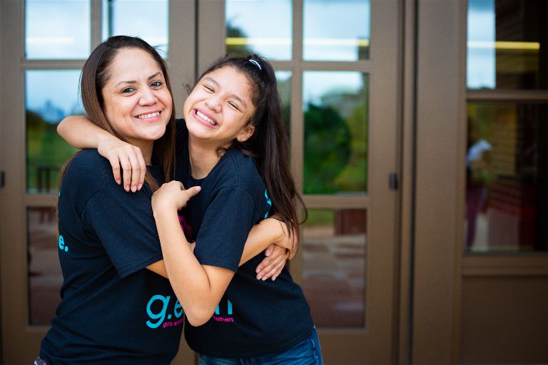 Girls Embracing Mothers