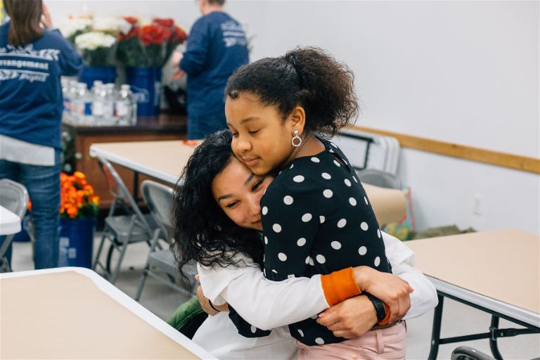 Girls Embracing Mothers