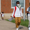 Jerrell Brown (left), 9, walks with Jayce Williams,