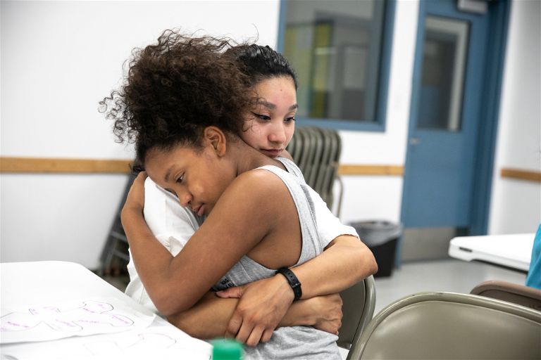 Girls Embracing Mothers