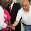 Jovenel Moise Andy Apaid shaking hands