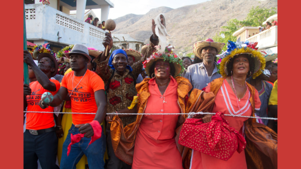 Celebrants hold maracas