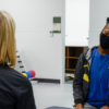 Chantel Thomas (right) works with senior physical therapist Katherine Resop