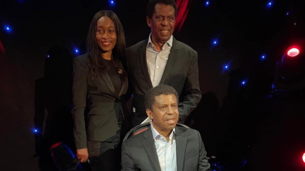 Dany Laferrière and a woman standing behind