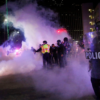 Dallas Police tactical officers fire rounds of tear gas at protestors