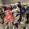 Dream Con attendees in signature character stances