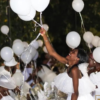 Attendees enjoy balloons