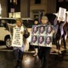 Protestors walk on Broad Street