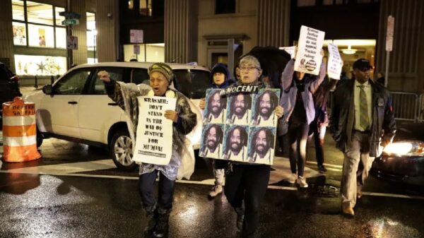 Protestors walk on Broad Street