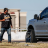 man stands on a median in Dallas soliciting