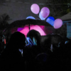 Community members gathered for a prayer service and balloon