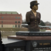 Cummings at the memorial to the women