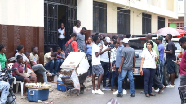 Haitians waiting in front of the Immigration Office