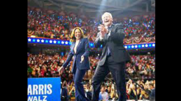 Kamala Harris and Tim Walz being joyous with audience. (1)