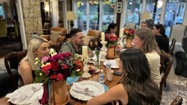 Attendees socializing during HCDFW Rosie Casals Lifetime Achievement Celebration at residence in Dallas