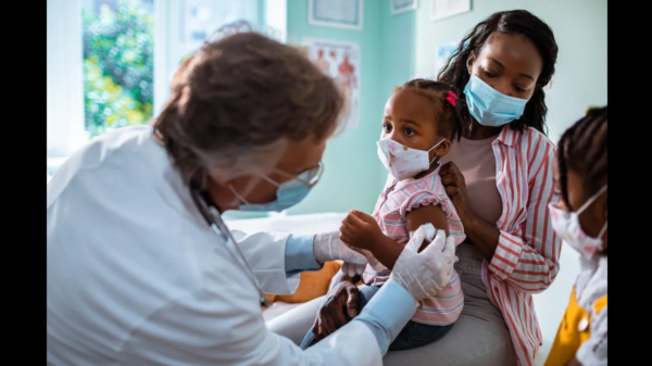 mother taking her daughter to the pediatrician to get vaccinated