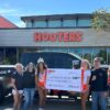 DFW Hooters donates nearly $3,500 to Guns and Hoses Foundation of North Texas